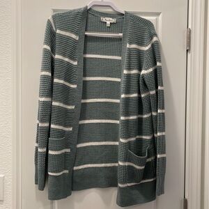 Large light blue and white striped knitted cardigan with pockets